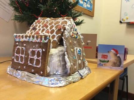 Christmas cake in the shape of a house made by Library Staff member